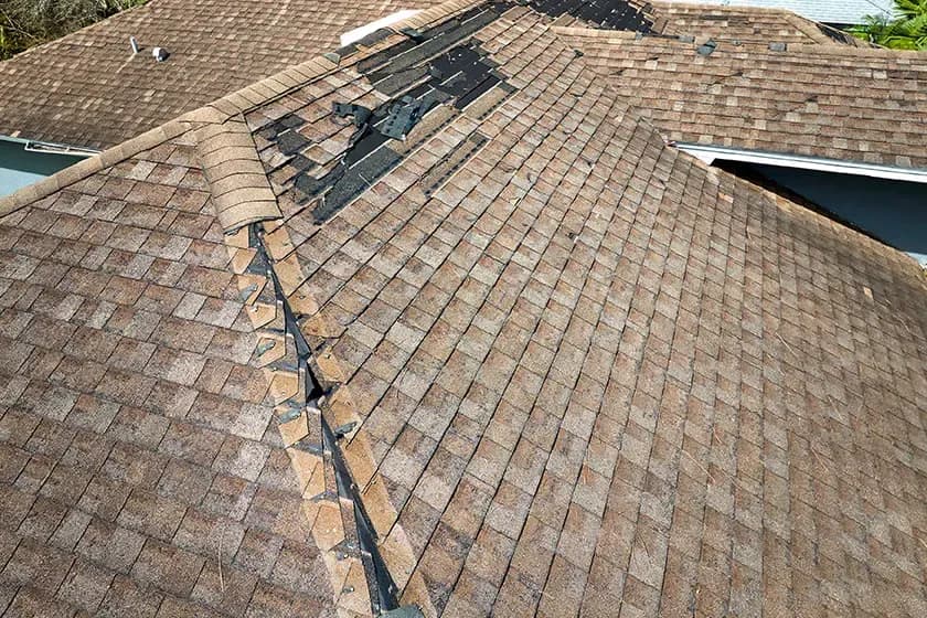 hurricane-damaged-shingle-roof-hurricane-ian-insurance-non-renewal-notice.webp